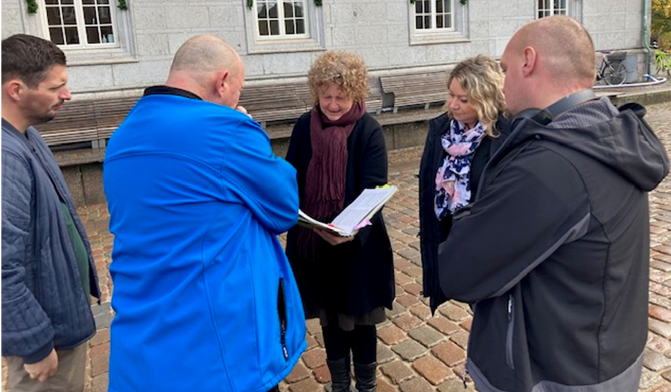 A culture facilitator with AoP participants on a historical city walk